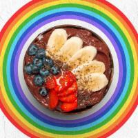 Chi Chia Acai Bowl · Acai bowl topped with chia seeds, bananas, strawberries, blueberries, and honey.