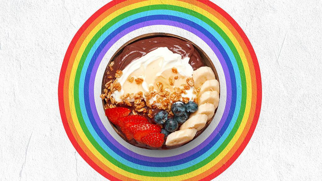 Earth Medicine Acai Bowl · Acai bowl topped with  greek yogurt, granola, bananas, strawberries, blueberries, and honey.