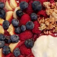 Ethereal Yogurt Bowl · Yogurt bowl topped with granola, blueberries, and strawberries.