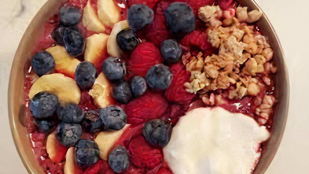Ethereal Yogurt Bowl · Yogurt bowl topped with granola, blueberries, and strawberries.