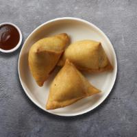 Samosa In The Summer  · Vegetables  in a fried crispy wheat layer. Served with tamarind chutney and mint.