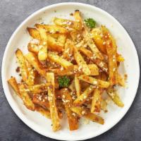 Garlic Tikka Fries · Potato fries tossed with minced garlic, parmesan cheese, and onions in a tikka sauce drizzle.
