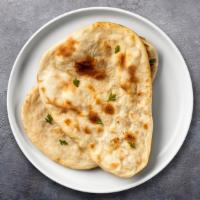 Classic Naan · Freshly baked bread in a clay oven.
