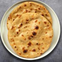 Tandoori Roti Ringer  · Whole wheat Indian bread cooked in a clay oven.