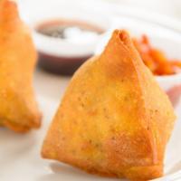 Samosa (2) · Vegan. Deep fried patties stuffed with fresh potatoes, green peas and freshly ground Indian ...