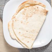 Garlic Naan · White flour bread with garlic, cilantro and chat masala.