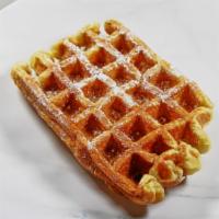 Belgian Waffle · Our very own belgian waffle topped off with powdered sugar. Each waffle comes with a side of...