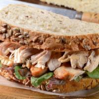 Turkey with Cranberry Sandwich · Delicious sandwich topped with Turkey and cranberry spread. Prepared to customer's order of ...