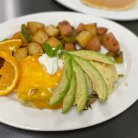 California Omelette · Avocado mushrooms, green onions, tomatoes, garlic, jack and cheddar cheese topped with sour ...