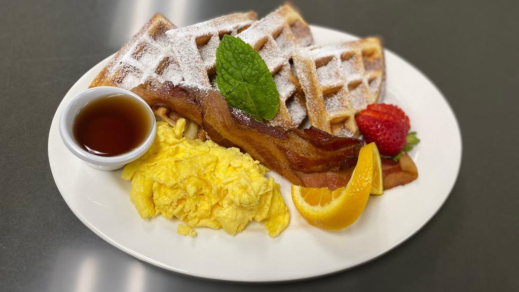 Hungarian Traditional Waffle · Crisp Hungarian waffle with two eggs any style and a choice of ham, bacon or sausage.