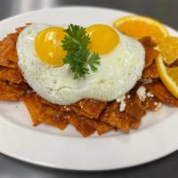 Chilaquiles · Scrambled or fried eggs with corn chips showered in our traditional Mexican chilaquiles sauc...
