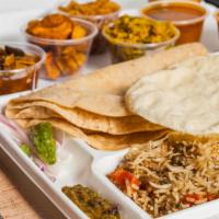 Thali · Veggie. Includes white rice, seasoned rice, curd rice, all curries of the day, dal, sambar, ...