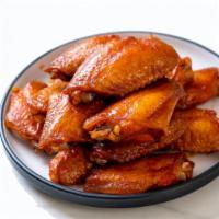 The Buffalo Wings · Golden-crispy golden chicken wings with sizzling buffalo sauce made to perfection.