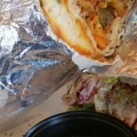 Chicken Garlic Wrap · Thin slices of marinated and grilled boneless chicken, tomatoes, lettuce, onions, garlic sau...