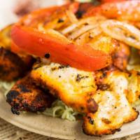 Chicken Kabob · Tender chicken cubes marinated with Mediterranean spices and grilled to perfection, served w...