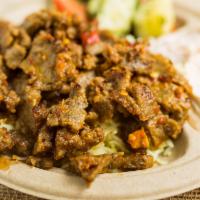 Lamb Plate · Thin slices of marinated and grilled lamb, hummus, Mediterranean salad, basmati rice and war...