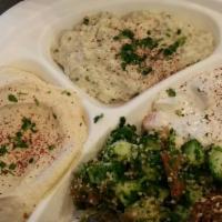 Veggie Plate · 2 falafel balls, 2 puffed grape leaves (dolma) baba ghannouj, hummus tabbouleh, Mediterranea...