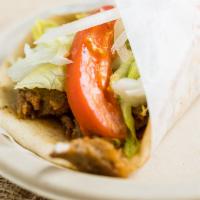 Lamb Gyro · Thin slices of grilled gyro meat, tomatoes, onions, lettuce and special homemade sauce wrapp...