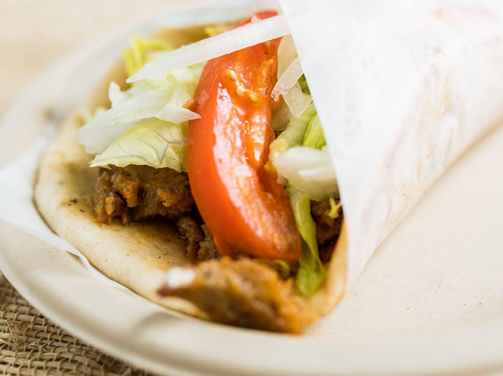 Lamb Gyro · Thin slices of grilled gyro meat, tomatoes, onions, lettuce and special homemade sauce wrapped in fresh pita bread.
