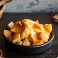 Patatas Bravas · crispy pimenton spiced potatoes with mojo picon (vegan, gluten free)<br />