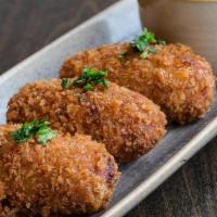 Birria Croquetas · birria braised goat and manchego cheese fritters (3 per order, contains dairy).
