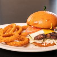 The Caboose Burger · 10 oz hand formed patty with american and swiss cheese onions, lettuce, pickles tomato, mayo...