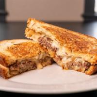 The Flat Car · Some might even call it a patty melt 1/4 lb. Patty with grilled onions and swiss cheese on t...