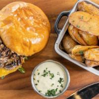 Truffled Mushroom Burger · 8oz certified angus beef burger grilled to order, topped with provolone +  caramelized onion...