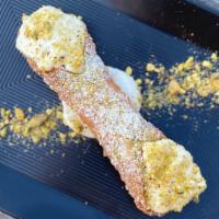 Cannoli · crispy cannoli shell filled with sweet ricotta dusted with chopped pistaschio nuts (optional)