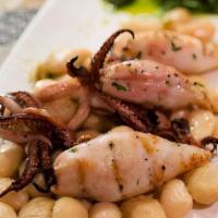 Calamari e Fagioli · Grilled Monterey Bay calamari with ‘Bianchi di Spagna’ beans. Arugula salad, olive crumbs, c...