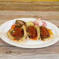 Regular Taco · Hand-made tortilla, Meat, Onion & Cilantro, and Salsa