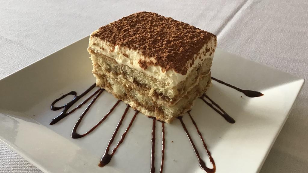 Tiramisu  · Lady fingers  cookies soaked in espresso and layered with mascarpone cheese and cocoa powder.