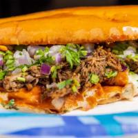 Birria Torta · Telera, cheese, beef Birria, cilantro, red onion.


*our birria is made with beef, if you pr...