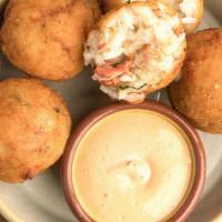 CRAB ARANCINI · rice fritters filled with fresh Dungeness crab meat, served with a calabrese aioli dipping s...