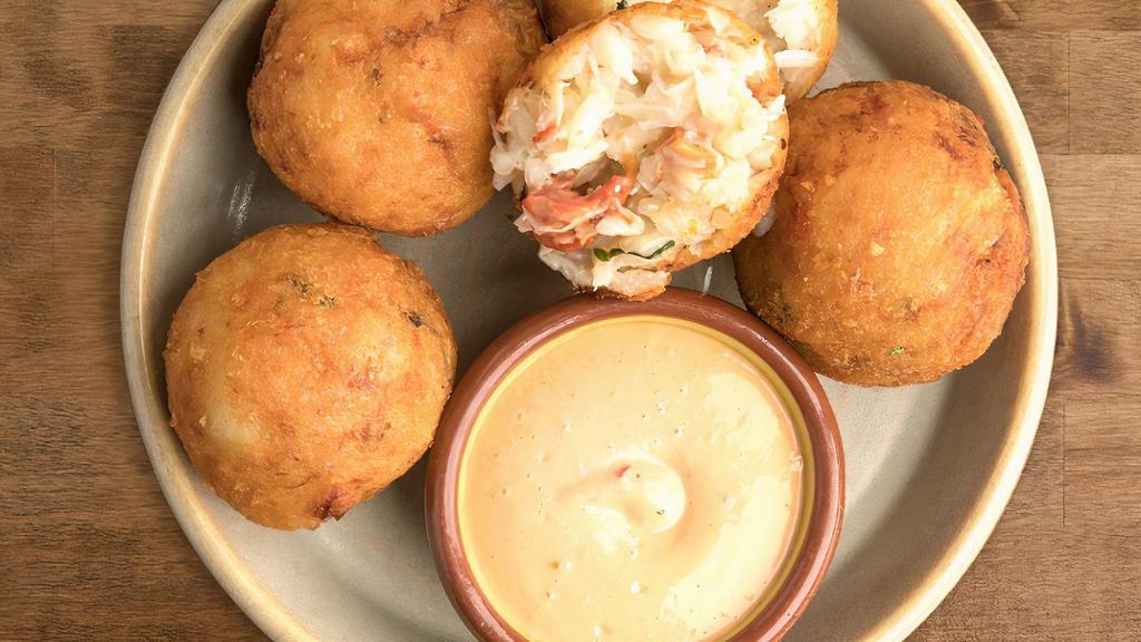 CRAB ARANCINI · rice fritters filled with fresh Dungeness crab meat, served with a calabrese aioli dipping sauce *gluten *egg *dairy