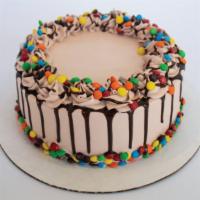 Dandy Candy Froyo Cake · Calling all M&M's lovers! This froyo cake has Chocolate Cake, Chocolate and Vanilla Froyo, O...