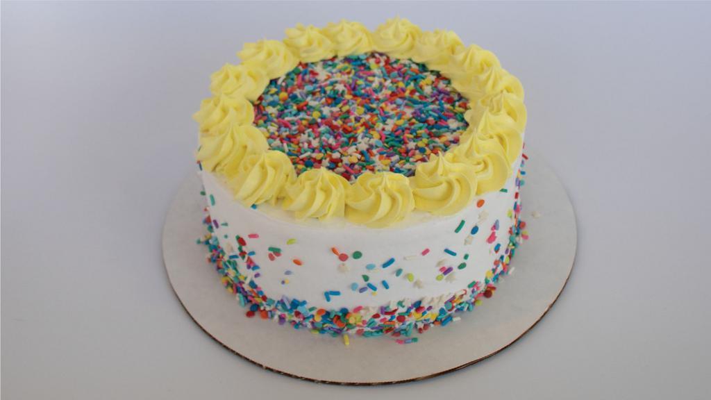 Confetti Froyo Cake · Cue the Confetti! Not only is this cake covered in delicious sprinkles, but the inside is a party too! Slice into layers of White Cake, Cake Batter and Vanilla Froyo, with crunchy sprinkles. This cake comes as an 8” round cake and serves 10-12 people. Icing color may vary.