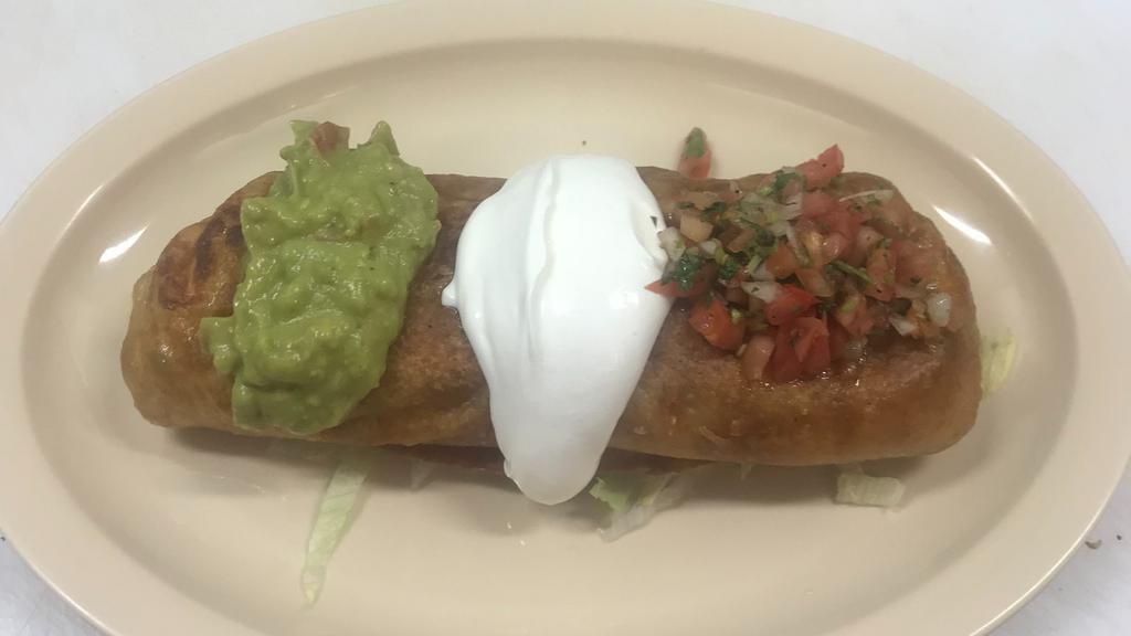 Chimichanga · Fried burrito. Meat, rice, beans and cheese inside topped with sour cream, guacamole and pico de gallo.