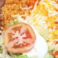 Three Enchiladas · Choice of meat, red or green sauce, topped with cheese, lettuce, guacamole and sour cream, s...