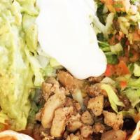 Taco Salad · Choice of meat, rice, beans, pico de gallo, lettuce, cheese, sour cream and guacamole.