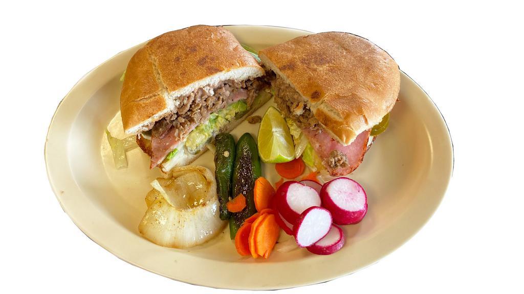 Super Torta (Mexican Sandwich) · Choice of meat, ham, sour cream, tomatoes, onions, lettuce, avocado, jalapenos and cheese.