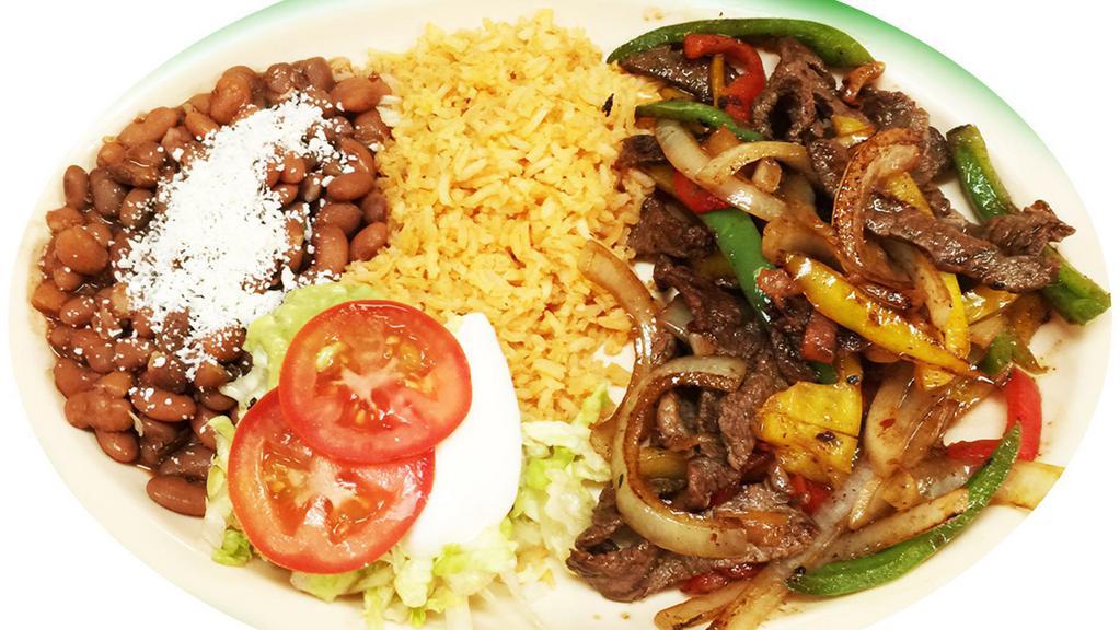 Steak Fajitas · Grilled onions, tomatoes and bell pepper. Served with rice, beans, tortillas, sour cream and guacamole