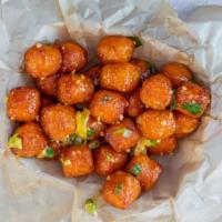 Sweet Potato Tater Tot's · Popcorn style tots tossed in spicy mayo with sliced pepperoncini, chive, cilantro.
