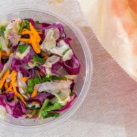 Spicy Rainbow Slaw · Red and green cabbage, green onion, cilantro, pickled peppers and onions, spicy mayo dressing.