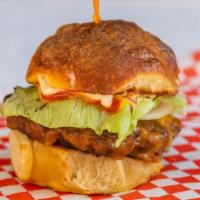 Mickeys Burgers · Butter seared 6 oz halal beef patty, served on a toasted house-made bun, topped with melted ...