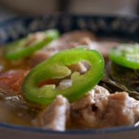Sinigang Plate · A Filipino staple, this tamarind based sour soup is delicious on cold days. Served tradition...