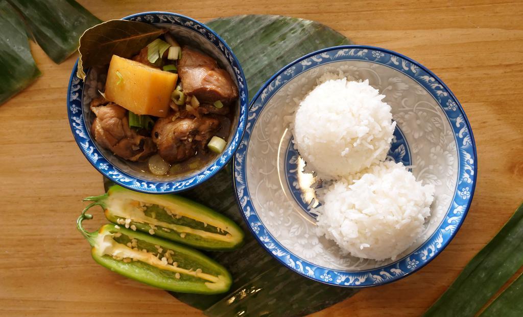 Chicken Adobo a la Carte · Braised chicken in a soy sauce and vinegar base with garlic, green onions and potatoes. Small feeds 1 to 2. Large feeds 3 to 5.