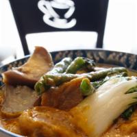 Beef Kare Kare a la Carte · Tender chunks of beef in a rich peanut butter based sauce with baby boy choy, long green bea...