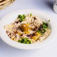 Hummus Platter · A mixture of mashed garbanzo beans, lemon juice and tahini, and garlic served with pita bread.