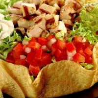 Taco Salad · Romaine, rice, beans, fresh salsa, guacamole, cheese and sour cream in a crisp tortilla shell.